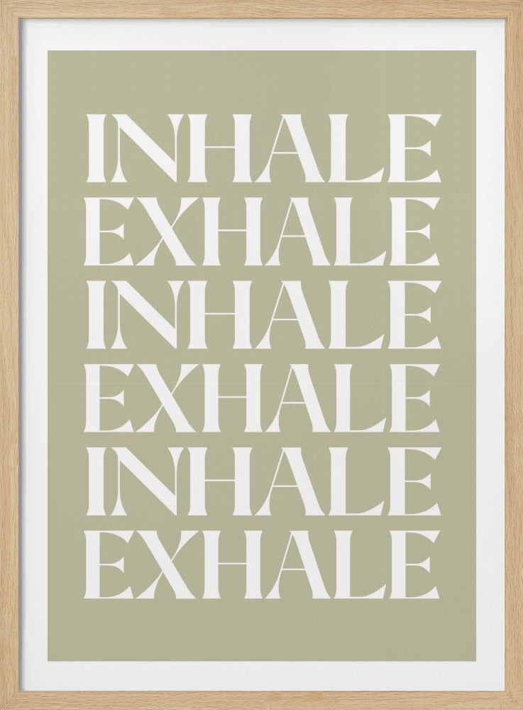 A minimalist art print featuring the words 'INHALE' and 'EXHALE' repeated in a vertical column. The text is in a bold, white serif font against a calming sage green background, all enclosed in a simple black frame. Print