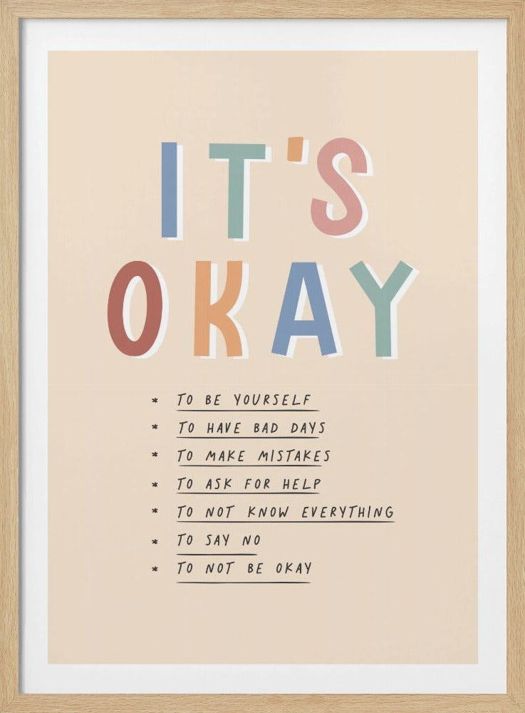An inspirational framed poster with the words 'IT'S OKAY' in large, colorful letters. Below is a list of affirmations including 'TO BE YOURSELF', 'TO HAVE BAD DAYS', and 'TO MAKE MISTAKES' on a beige background. Artwork