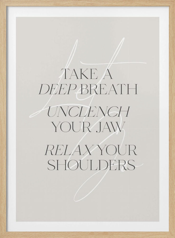 A minimalist typography art print with a light grey background and a thin black frame. The text, in a black serif font, reads 'TAKE A DEEP BREATH UNCLENCH YOUR JAW RELAX YOUR SHOULDERS'. A delicate, white script flourish is overlaid on the text. Wall Art
