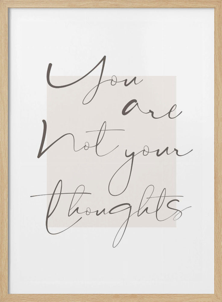 A framed minimalist artwork featuring the quote 'You are not your thoughts' written in a dark grey, flowing cursive script. The text is centered over a light beige rectangular block on an off-white background, enclosed in a thin black frame. Poster