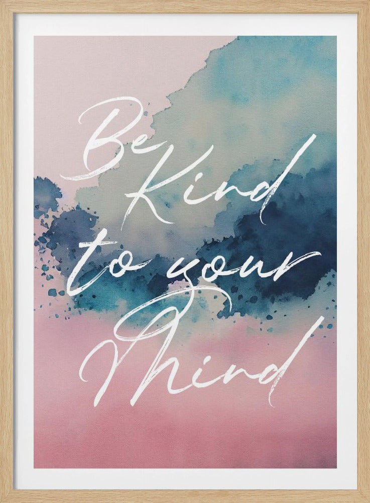 An inspirational art print with a watercolor background blending from pink at the bottom to blue at the top. The phrase 'Be Kind to your Mind' is written in a flowing white cursive script over the background. The entire piece is framed in a simple black frame. Print