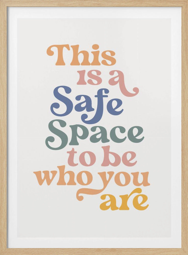 A framed poster with the inspirational quote 'This is a Safe Space to be who you are' written in a colorful, retro 70s-style font against a white background. Artwork