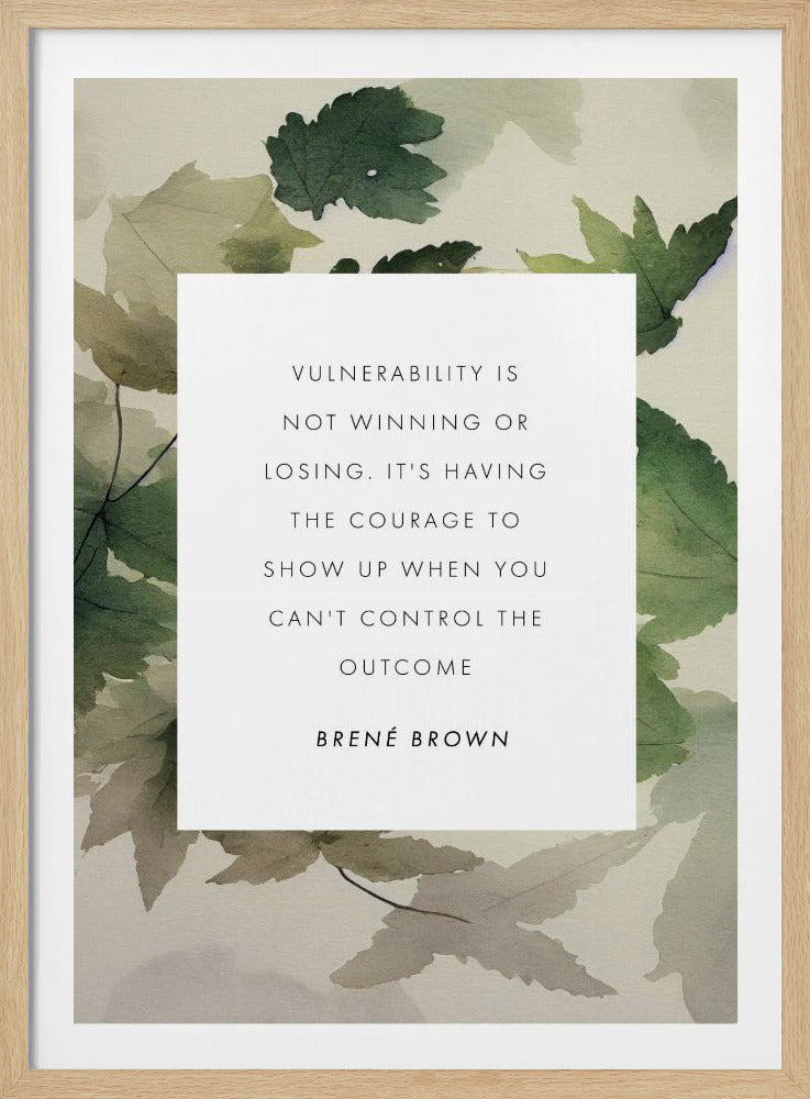 A framed art print featuring an inspirational quote by Brené Brown. The quote, 'Vulnerability is not winning or losing. It's having the courage to show up when you can't control the outcome,' is printed in black uppercase letters on a central white rectangle. The background consists of a soft watercolor illustration of green and beige leaves. The piece is enclosed in a simple black frame. Wall Art