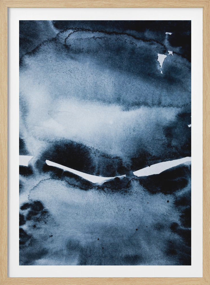 An abstract watercolor painting in a black frame, featuring various shades of deep indigo and muted blue. The colors bleed into each other creating a cloudy, atmospheric effect, with a sharp, jagged white line breaking through the center. Artwork