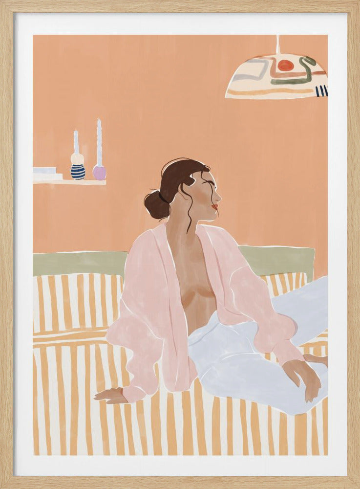 A stylized illustration of a woman with her brown hair in a bun, sitting on a yellow and white striped bed. She is wearing a light pink open robe and light blue trousers, looking away from the viewer against a solid peach-colored wall. A decorative pendant light hangs above her. Decor