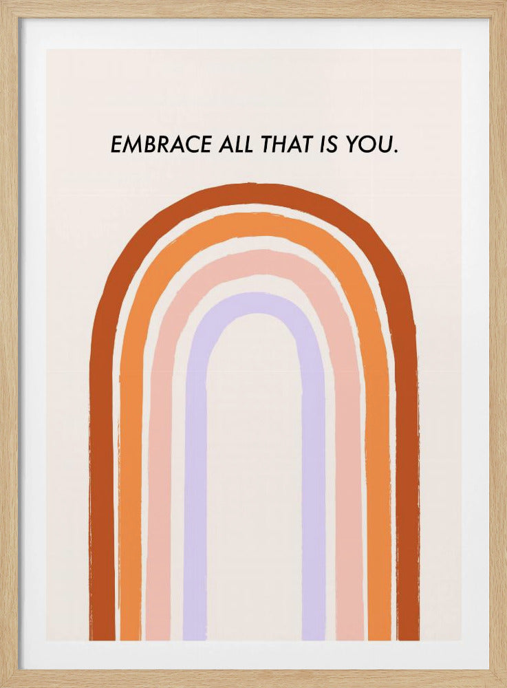 A framed art print with an inspirational quote. On a cream background, the black text reads 'EMBRACE ALL THAT IS YOU.' Below the text is a large, stylized U-shaped rainbow with thick, painted bands of terracotta, orange, pink, and lavender. Print