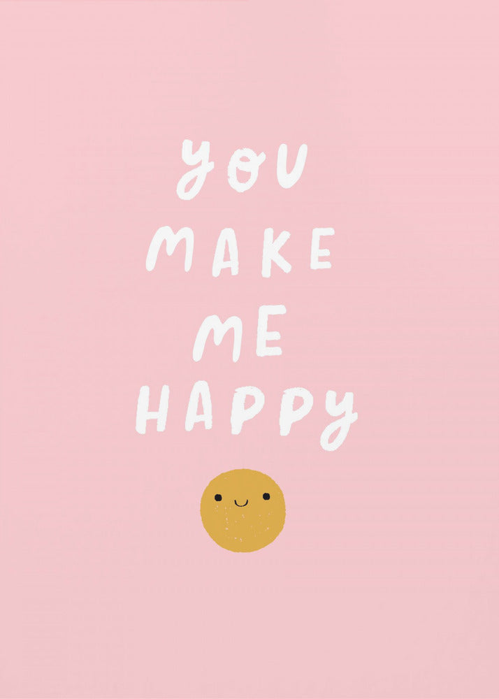 A framed poster with a light pink background featuring the phrase 'you make me happy' in a playful, white, handwritten font, with a simple yellow smiley face below the text. Poster