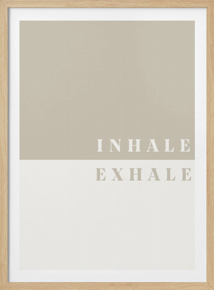 A minimalist framed print featuring a color-blocked design. The top half is a solid tan color with the word 'INHALE' in a light, elegant serif font. The bottom half is off-white with the word 'EXHALE' directly below in the same style. Artwork
