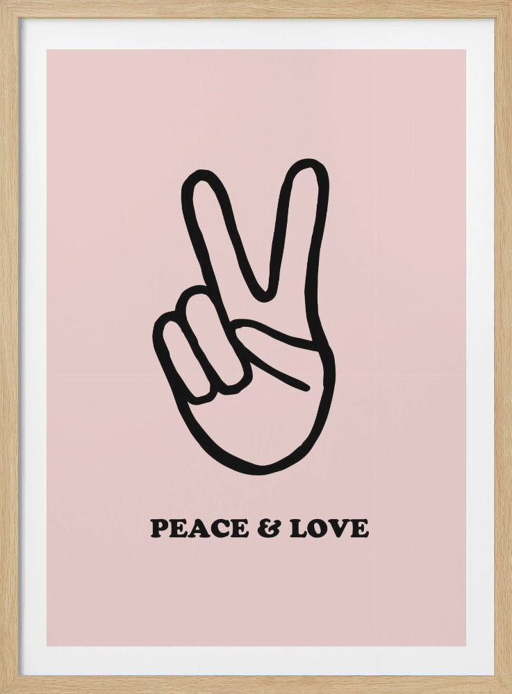 A minimalist art print with a light pink background featuring a bold black outline of a hand making a peace sign. Below the hand, the words 'PEACE & LOVE' are printed in a black serif font. The print is enclosed in a simple black frame. Print