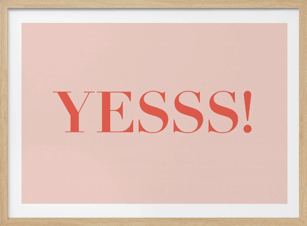 A framed piece of art with the word 'YESSS!' in a bold, red serif font centered on a light pink background. The artwork is housed in a simple silver frame. Decor