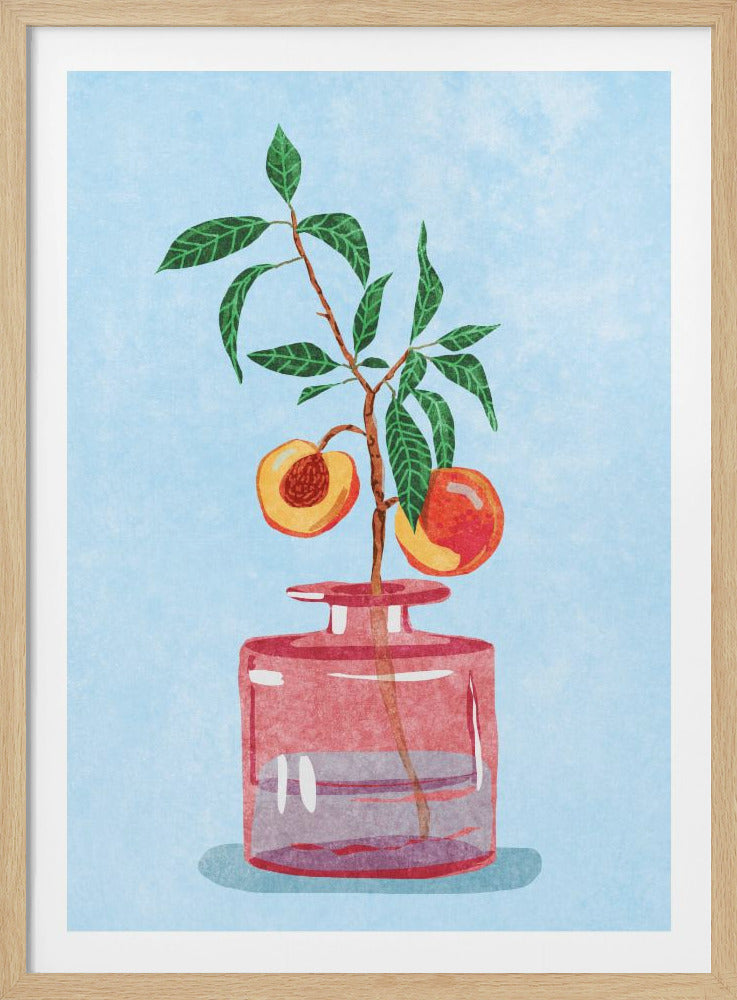A watercolor-style illustration of a peach branch with green leaves and two peaches, one whole and one cut in half, placed in a transparent pink glass vase against a light blue, textured background. The artwork is shown within a black frame. Print