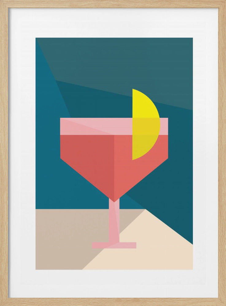 A minimalist, geometric art print of a pink cocktail in a stemmed glass, garnished with a yellow lemon slice. The background is composed of angular shapes in shades of teal and blue, and the glass sits on a beige surface. Print