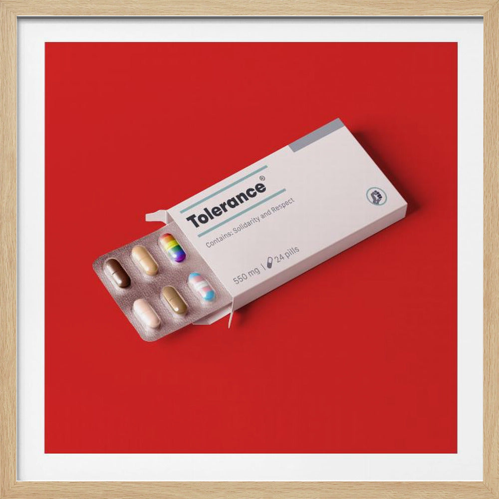 A framed conceptual art piece on a bright red background. It features a white medicine box labeled 'Tolerance', with a blister pack of pills emerging. Most pills are in various skin tones, but one is a rainbow pride flag and another is a transgender pride flag. Artwork