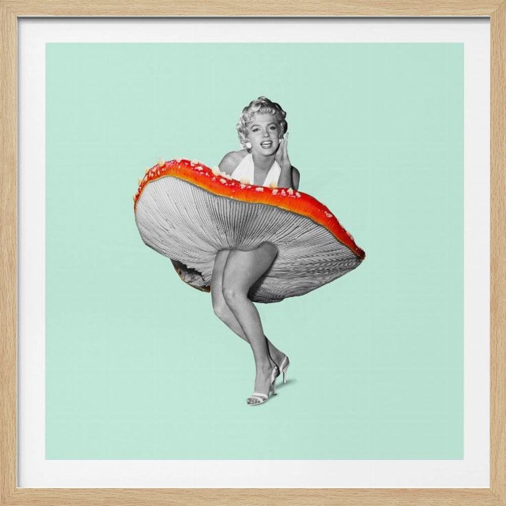 A surreal pop art collage featuring a black-and-white image of Marilyn Monroe. In a playful twist on her iconic pose, she emerges from a giant red amanita mushroom, its gilled underside mimicking her famous windswept skirt. The background is a solid mint green, and the artwork is presented in a light wood frame. Artwork