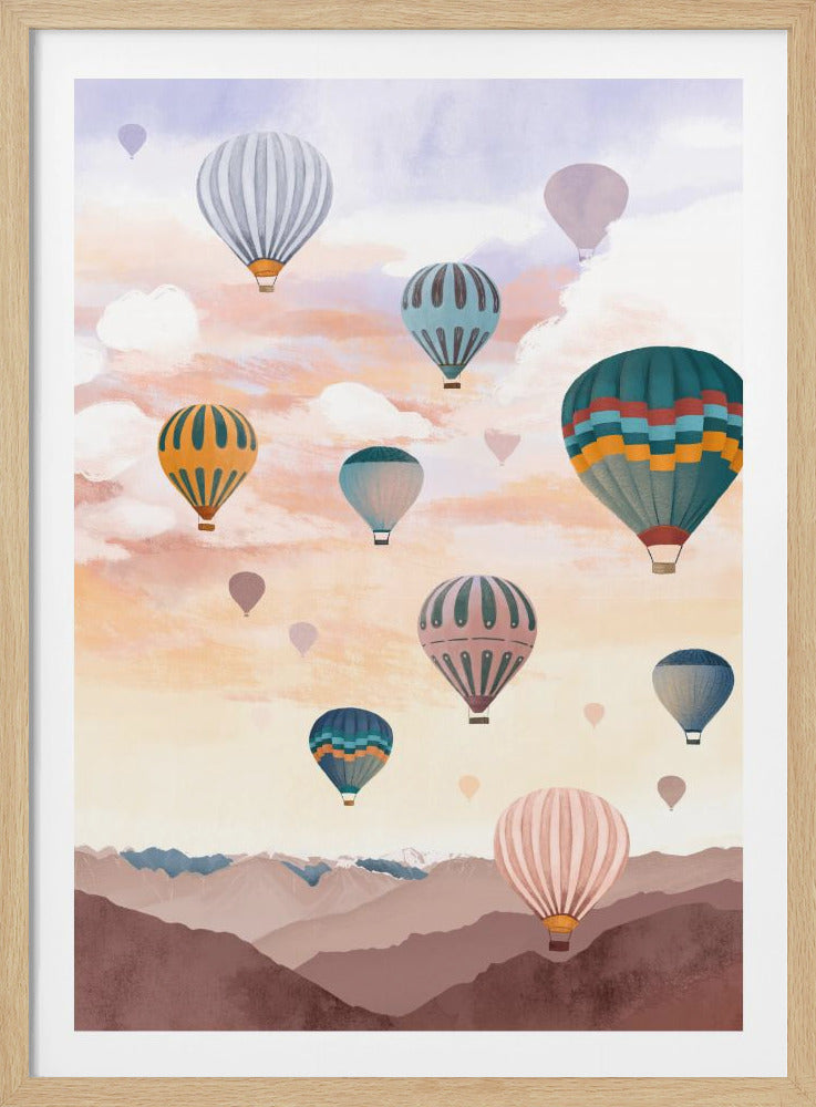 A whimsical illustration of many colorful hot air balloons floating in a pastel-colored sky above a stylized mountain range. The sky is a blend of pale purple, pink, and orange with soft white clouds, and the balloons feature various patterns and hues. Wall Art