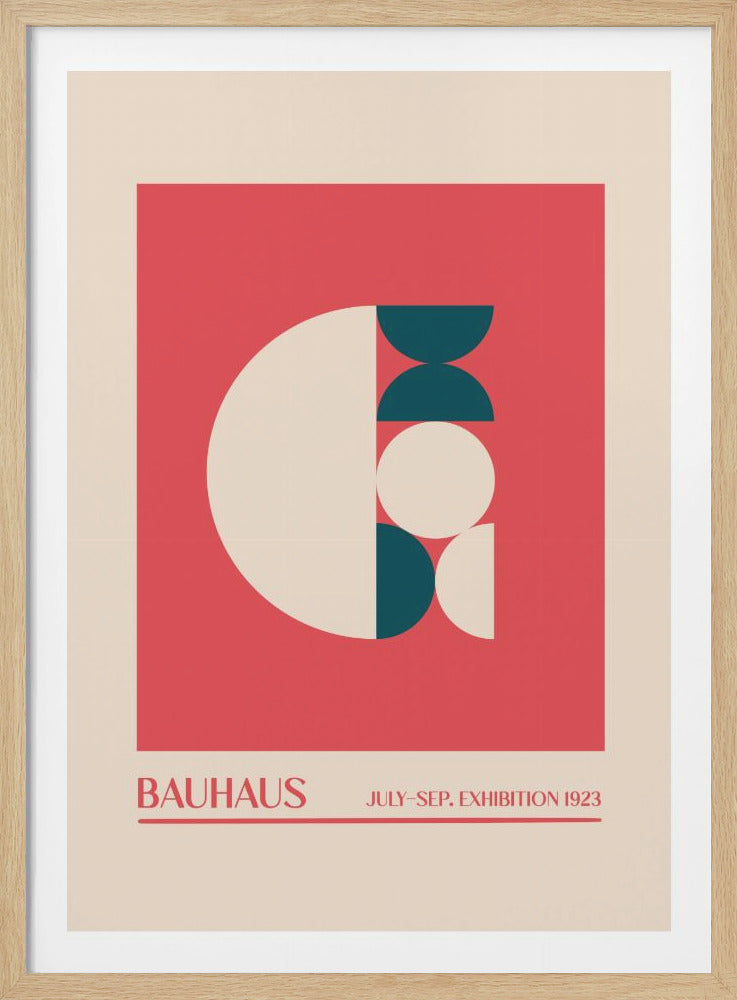 A vintage-style Bauhaus exhibition poster from 1923, presented in a black frame. The poster features an abstract geometric design on a coral-red background, composed of large cream and dark teal circles and semi-circles. Below the design, text reads 'BAUHAUS' and 'JULY-SEP. EXHIBITION 1923' on a cream-colored border. Decor