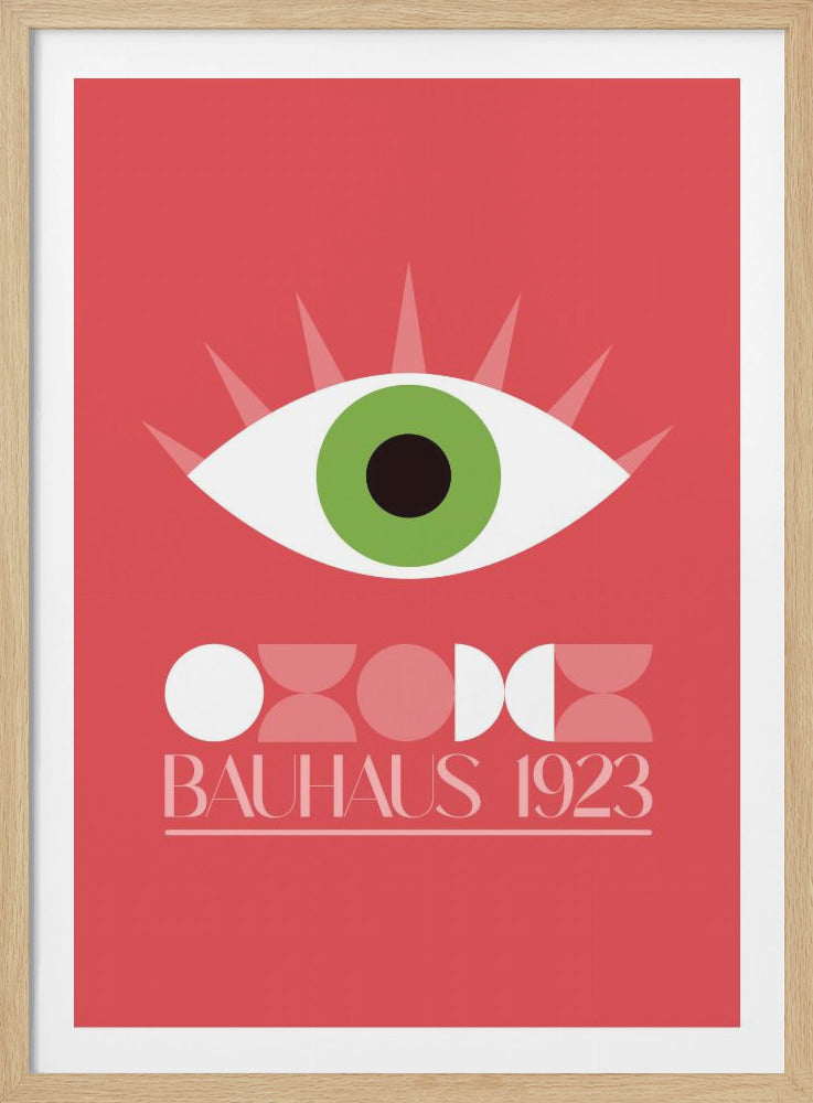 A vintage Bauhaus exhibition poster from 1923 featuring a stylized green eye above abstract geometric shapes on a salmon pink background, all enclosed in a black frame. Print