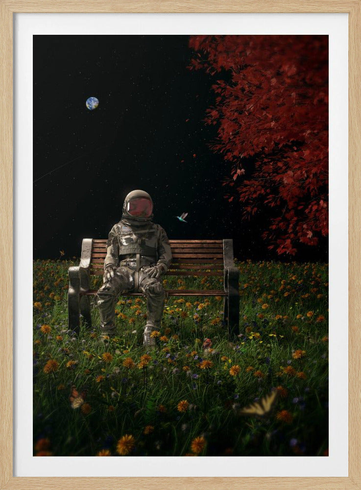 A surreal scene depicting an astronaut in a full spacesuit sitting alone on a wooden park bench in a vibrant field of wildflowers under a starry night sky. The planet Earth is visible in the distance, and a large tree with red leaves frames the right side of the image. Poster