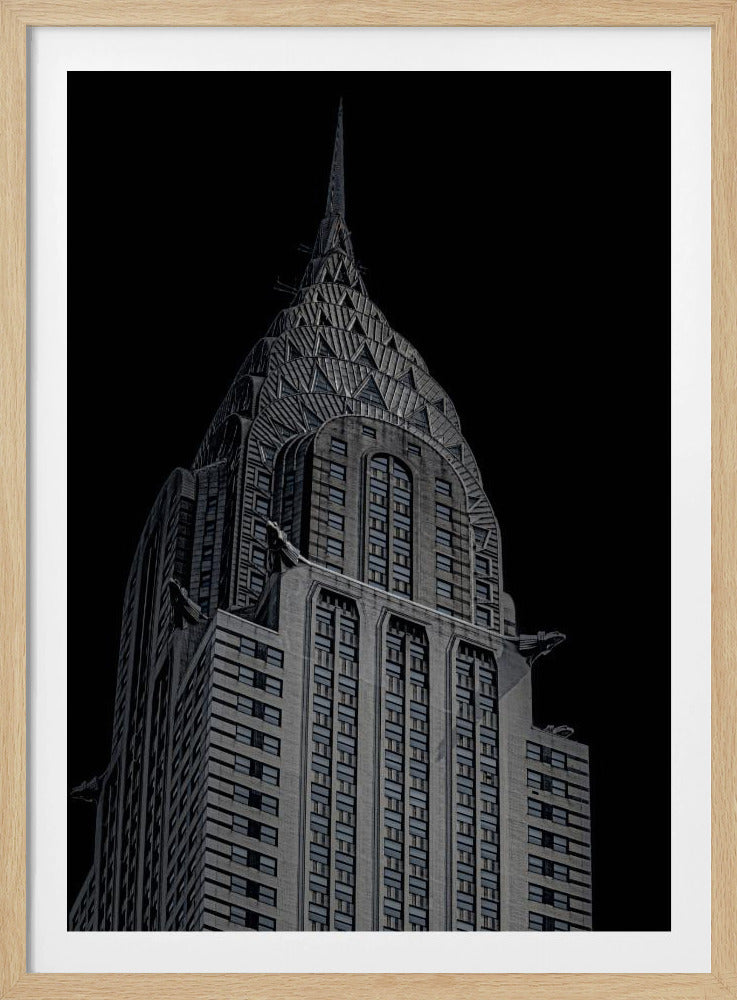 A dramatic, low-angle, black and white photograph of the top of the Chrysler Building, showcasing its iconic Art Deco spire and architectural details against a solid black background. Decor
