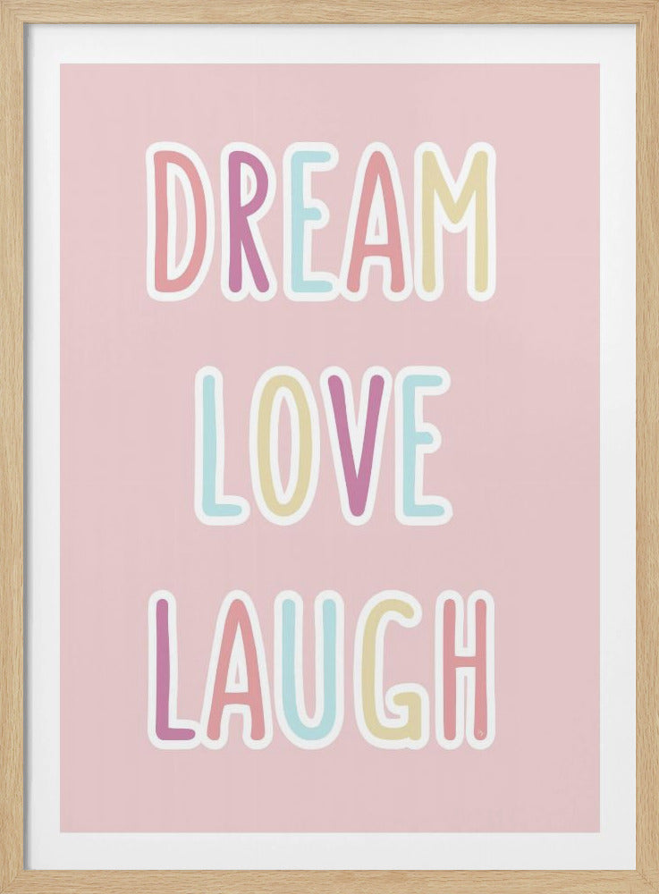 A framed art print with a light pink background featuring the words 'DREAM', 'LOVE', and 'LAUGH' stacked vertically. The text is in a fun, rounded, multi-colored pastel font with a white outline, all enclosed in a simple black frame. Poster