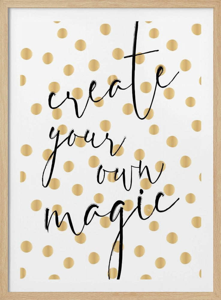 An inspirational wall art piece with the phrase 'create your own magic' in a black, flowing script. The background is white with a pattern of shiny gold polka dots, and the entire piece is set within a simple black frame. Artwork