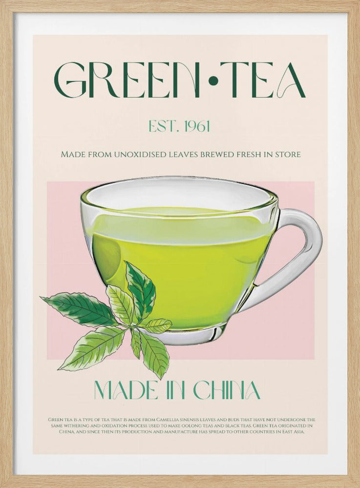 A vintage-style advertisement poster for green tea. It features a central illustration of a glass cup filled with bright green liquid, with a sprig of tea leaves in the foreground. The background is a soft pink, and the text reads 'GREEN TEA', 'EST. 1961', and 'MADE IN CHINA' in a dark green elegant font. Decor