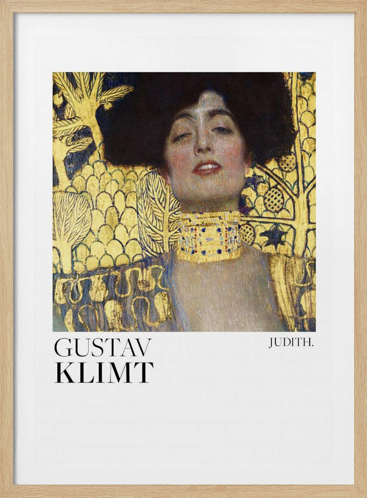 A framed art print of Gustav Klimt's painting 'Judith I'. The artwork features a portrait of a woman with dark hair and a gold choker against a lavish gold-leaf background. The artist's name and the title 'JUDITH.' are printed below the image on a white border. Print