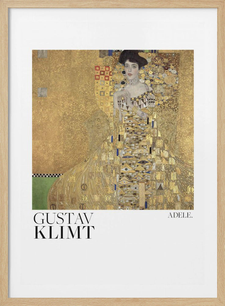 A framed art print of Gustav Klimt's painting 'Portrait of Adele Bloch-Bauer I'. The image features a woman in an ornate, golden gown against a shimmering, patterned gold background. The print has a wide white border with 'GUSTAV KLIMT' on the bottom left and 'ADELE.' on the bottom right, all within a thin black frame. Artwork