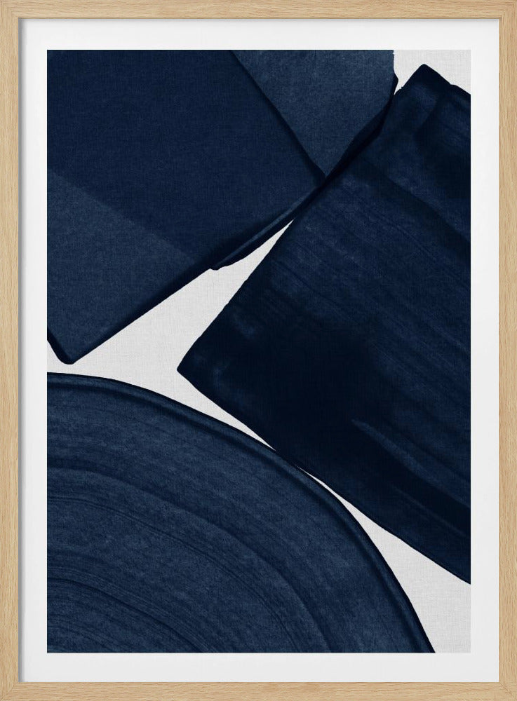 An abstract painting featuring bold, wide brushstrokes of deep indigo blue on a textured white canvas. The composition is dynamic, with overlapping angular and curved shapes that create a sense of movement. The artwork is framed in a simple black frame. Wall Art