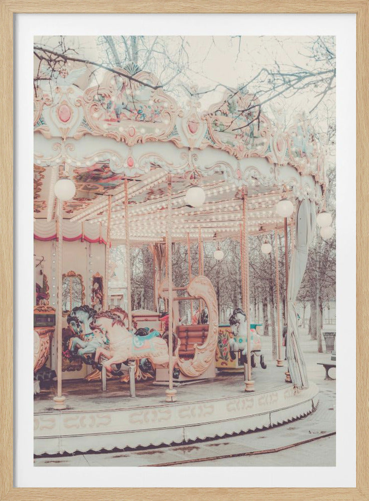 A vintage-style photograph of an ornate carousel with pastel pink and cream colors, featuring decorated horses and warm, glowing lights, set in a park with bare trees in the background. Poster