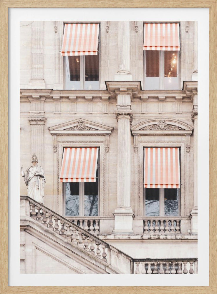 A detailed photograph of the facade of a classic European building, featuring ornate stone carvings, columns, and a grand staircase. Several windows are adorned with distinctive peach and white striped awnings, adding a touch of color to the neutral stone palette. Poster