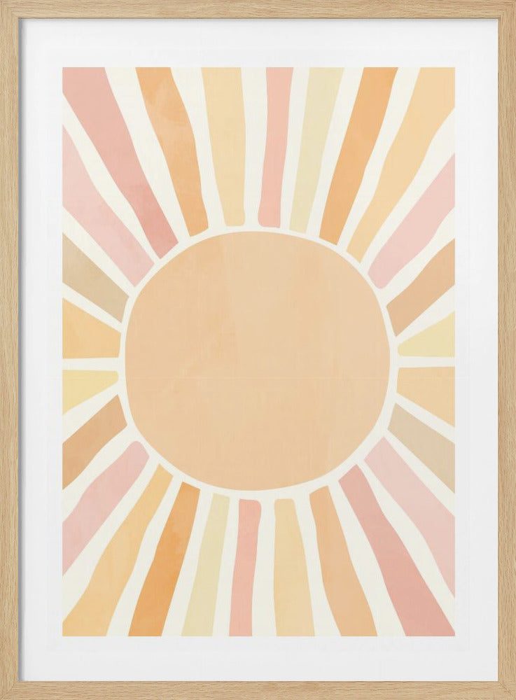 A framed art print featuring a stylized, minimalist sun. A large, solid peach-colored circle forms the center, with thick, irregular rays of light radiating outwards in shades of pastel pink, orange, and yellow, set against a cream-colored background. The overall style is modern and bohemian. Artwork