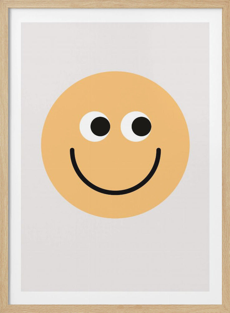 A minimalist art print of a large yellow smiley face centered on a white background. The face has two large white and black cartoon eyes and a wide, simple black line for a smiling mouth. The print is displayed in a thin black frame. Decor