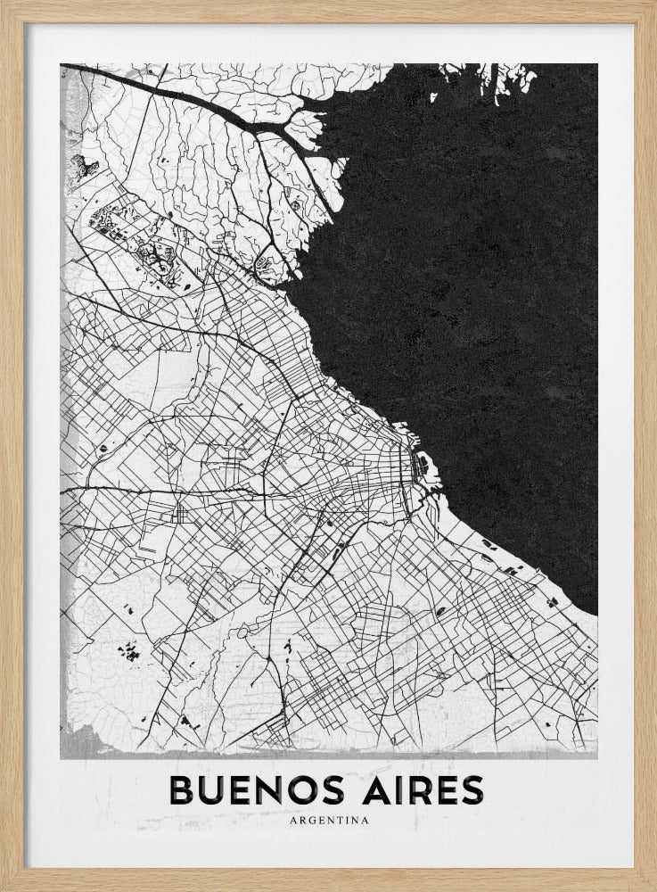 A minimalist black and white map of Buenos Aires, presented as a poster in a black frame. The city's roads and geography are detailed in black lines on a white background, while the adjacent body of water is solid black. The text 'BUENOS AIRES' is displayed at the bottom. Wall Art