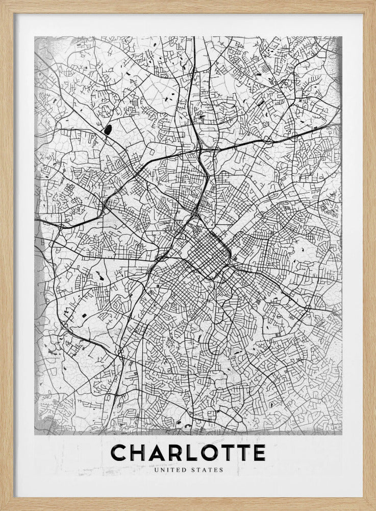 A minimalist black and white map of Charlotte, North Carolina, displayed in a black frame. The map details the intricate network of city streets and highways. At the bottom, a white banner features the city's name 'CHARLOTTE' in a bold, black, sans-serif font. Poster