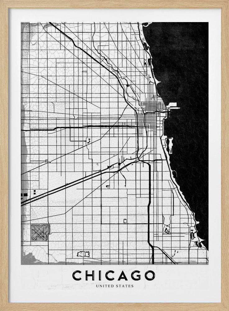 A minimalist black and white map of Chicago, featuring a grid street layout, major thoroughfares, and the shoreline of Lake Michigan. The map has a subtle crackled texture, is enclosed in a black frame, and has the word 'CHICAGO' in capital letters at the bottom. Decor