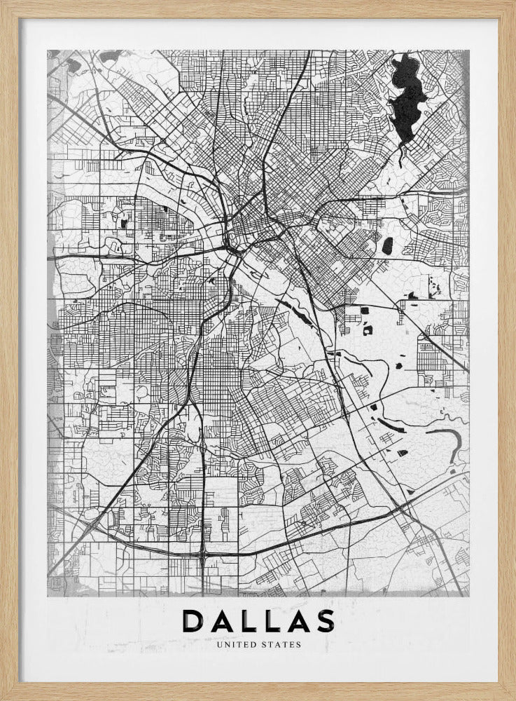 A minimalist black and white street map of Dallas, Texas, presented vertically in a black frame. The intricate network of roads and highways is depicted in black lines on a light gray, textured background, with the city's name 'DALLAS' in bold capital letters at the bottom. Poster