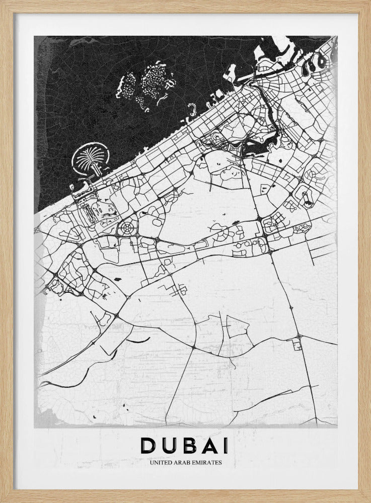 A minimalist black and white map of Dubai in a black frame. The water is depicted in black with a subtle texture, while the land is white, showing the city's road network in thin black lines. Key features like the Palm Jumeirah and The World Islands are visible off the coast. The word 'DUBAI' is written in a bold, black, sans-serif font at the bottom. Decor