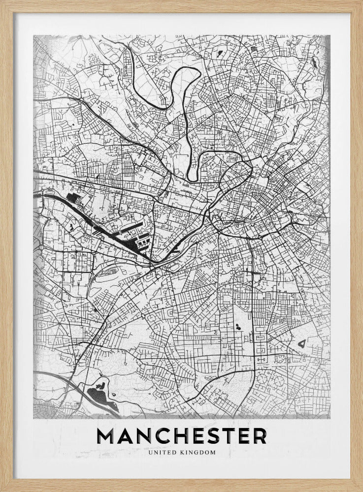 A minimalist black and white street map of Manchester, UK, displayed in a simple black frame. The map details the intricate network of roads and waterways, with the city's name 'MANCHESTER' printed in a bold, modern font at the bottom. Wall Art