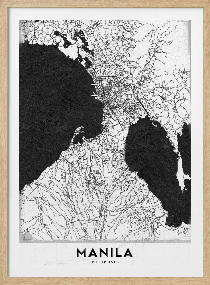 A minimalist black and white map of Manila, Philippines, presented in a black frame. The map showcases the city's intricate road network in black lines on a white landmass, contrasted against textured black bodies of water. The word 'MANILA' is printed in a bold, black sans-serif font at the bottom of the poster. Decor