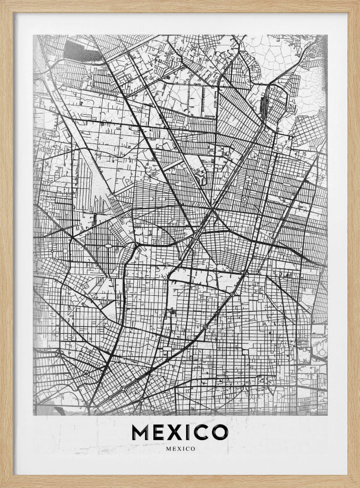 A modern, minimalist black and white art print of a street map of Mexico City, enclosed in a simple black frame. The intricate road network is depicted with black lines on a textured white background. The word 'MEXICO' is printed in bold, black capital letters at the bottom. Print