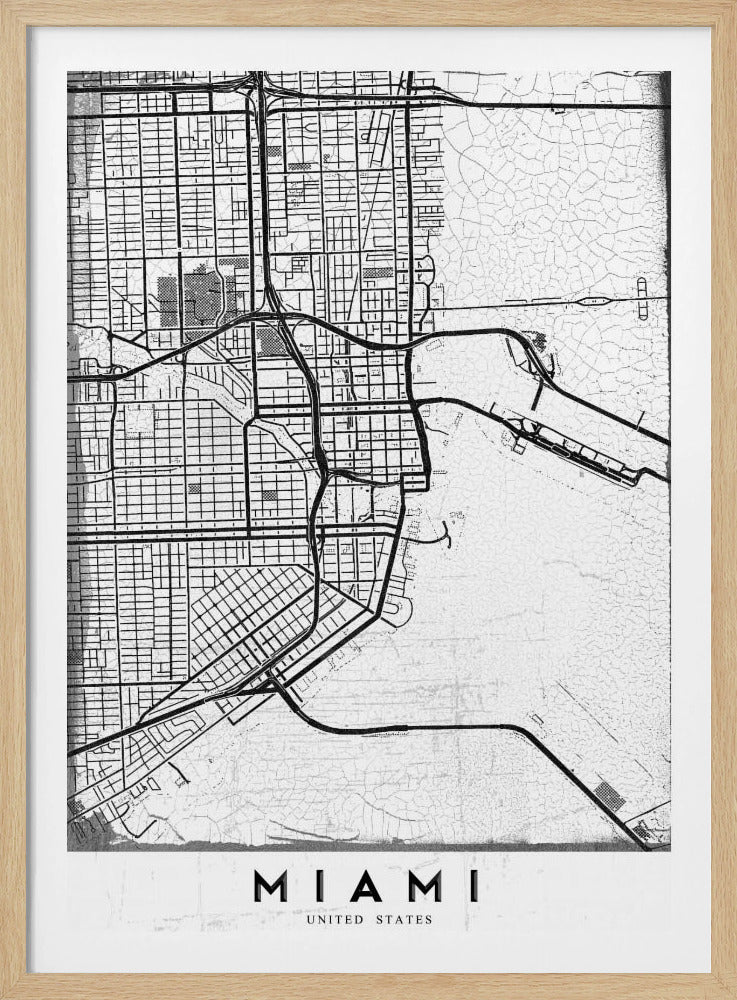 A minimalist black and white street map of Miami, Florida, with a distressed, textured background. The map is framed in black with the word 'MIAMI' printed in bold capital letters at the bottom. Artwork