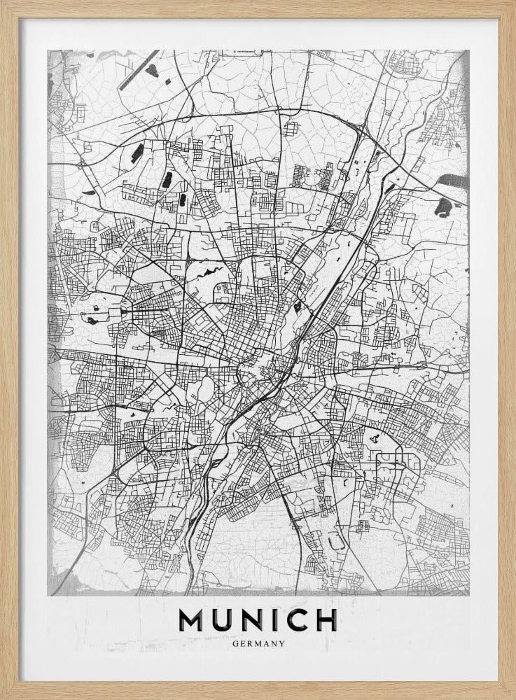 A minimalist black and white street map of Munich, Germany, presented in a thin black frame. The map shows intricate road networks and geographical features on a textured white background, with the word 'MUNICH' in a bold, black, sans-serif font at the bottom. Wall Art