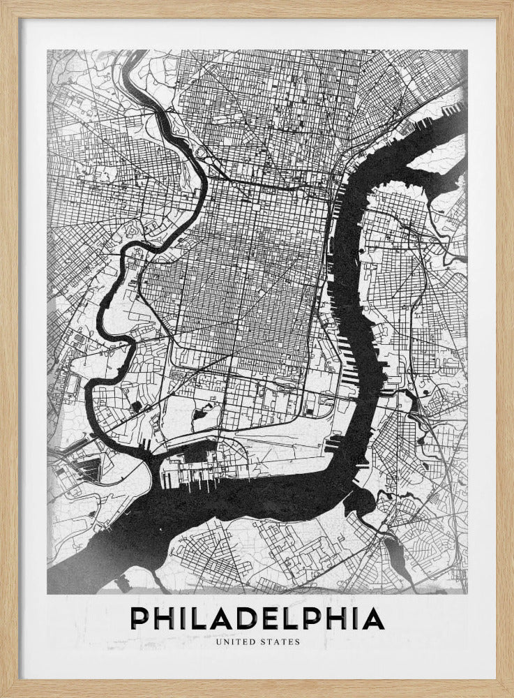 A modern black and white framed poster of a city map of Philadelphia. The map details the street grid, with the Schuylkill and Delaware rivers prominently featured in solid black. The word 'PHILADELPHIA' is printed in a bold, black sans-serif font at the bottom. Artwork