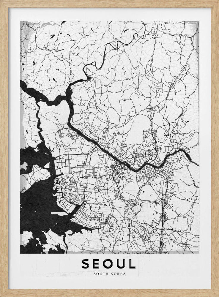 A minimalist black and white map of Seoul, South Korea, showing the city's intricate network of roads and the Han River. The map is presented in a modern, artistic style with a simple black frame and the word 'SEOUL' in bold capital letters at the bottom. Decor