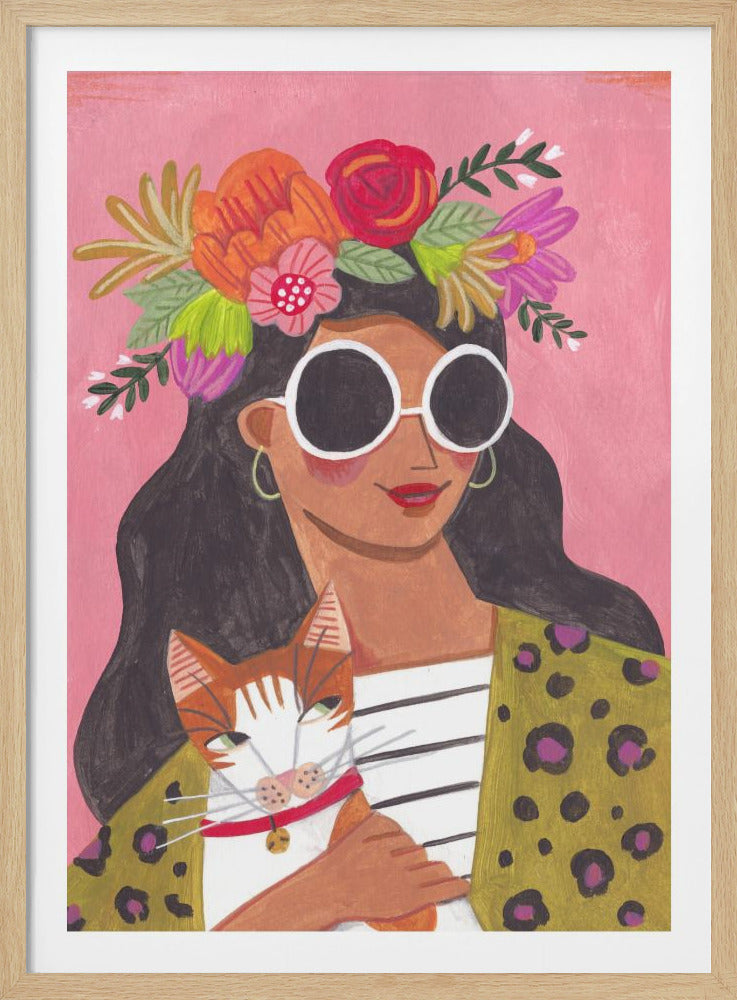 A stylized painting of a fashionable woman with long dark hair wearing a colorful flower crown and large white sunglasses. She is holding a ginger and white cat and wears a leopard print jacket over a striped shirt, all set against a solid pink background. Wall Art