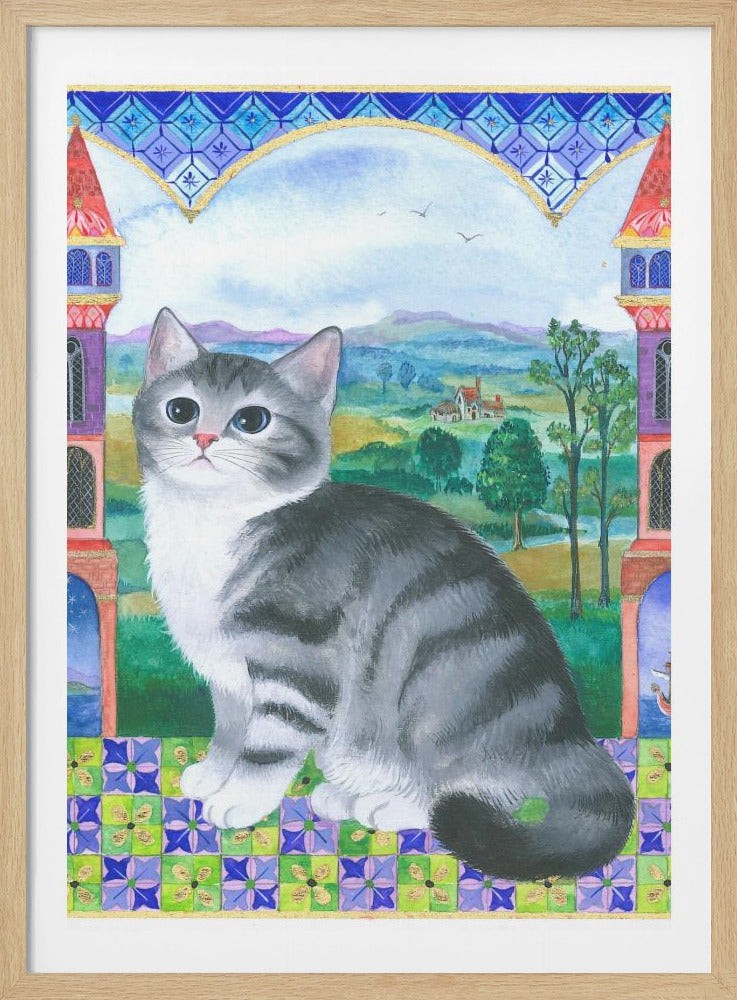 A whimsical painting of a grey and white tabby cat with large, innocent eyes sitting on a colorful tiled surface. The scene is framed by a decorative blue arch and two colorful towers, revealing a lush green landscape with hills and a small house in the background. Decor