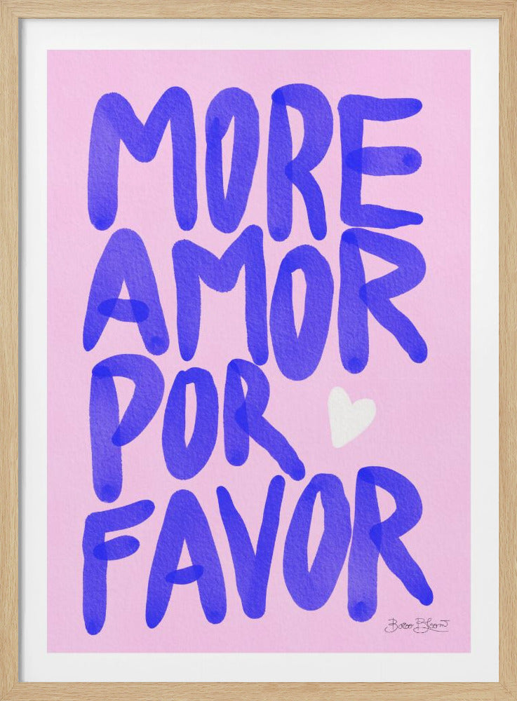 A typography art piece with a light pink background featuring the phrase 'MORE AMOR POR FAVOR' in a bold, hand-painted blue font. A small white heart is positioned between the words 'POR' and 'FAVOR'. The artwork has a playful, textured feel and is shown in a black frame. Print