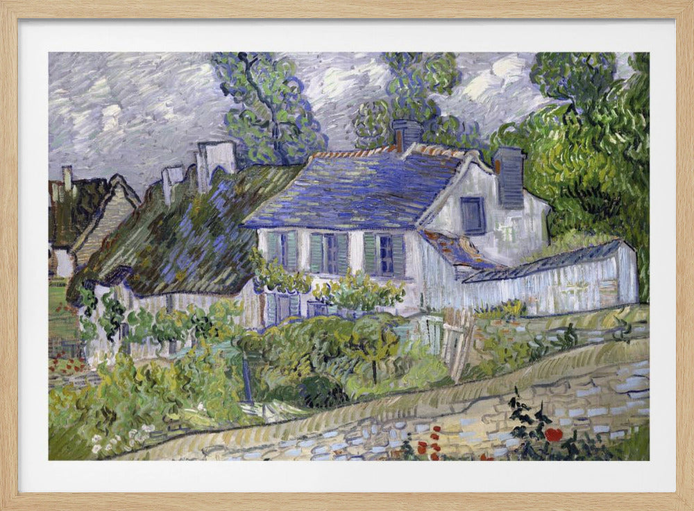 A post-impressionist painting by Vincent van Gogh depicting a quaint village scene. The artwork, characterized by thick, energetic brushstrokes, features houses with blue and thatched roofs, surrounded by lush green trees and foliage under a cloudy sky. The scene is framed in a simple silver border. Print