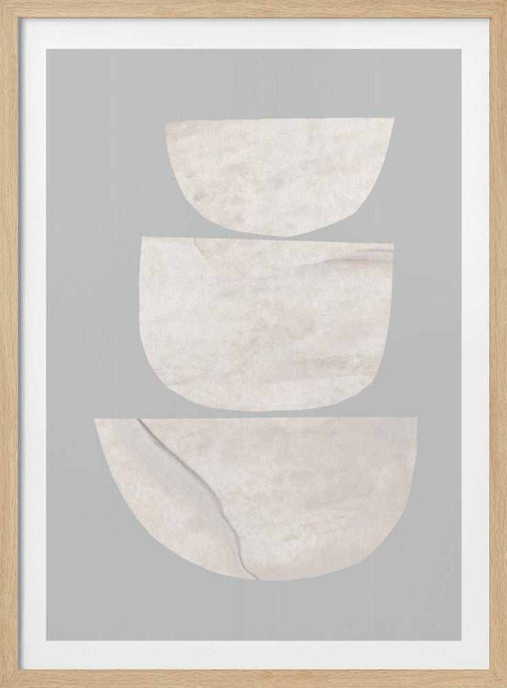 A vertical abstract artwork in a thin black frame featuring three stacked semi-circular shapes against a solid light gray background. The shapes, textured with shades of beige and off-white, increase in size from top to bottom. Wall Art